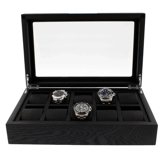 The Tempus Luxury Watch Winders 10 Watch Box Premium Black Oak Veneer features a glass lid, displays three silver watches in a row, and includes padded slots for up to ten timepieces.