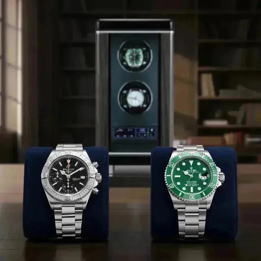Breitling Chronomat and Rolex Submariner watches displayed on blue stands, with a watch winder in the background.