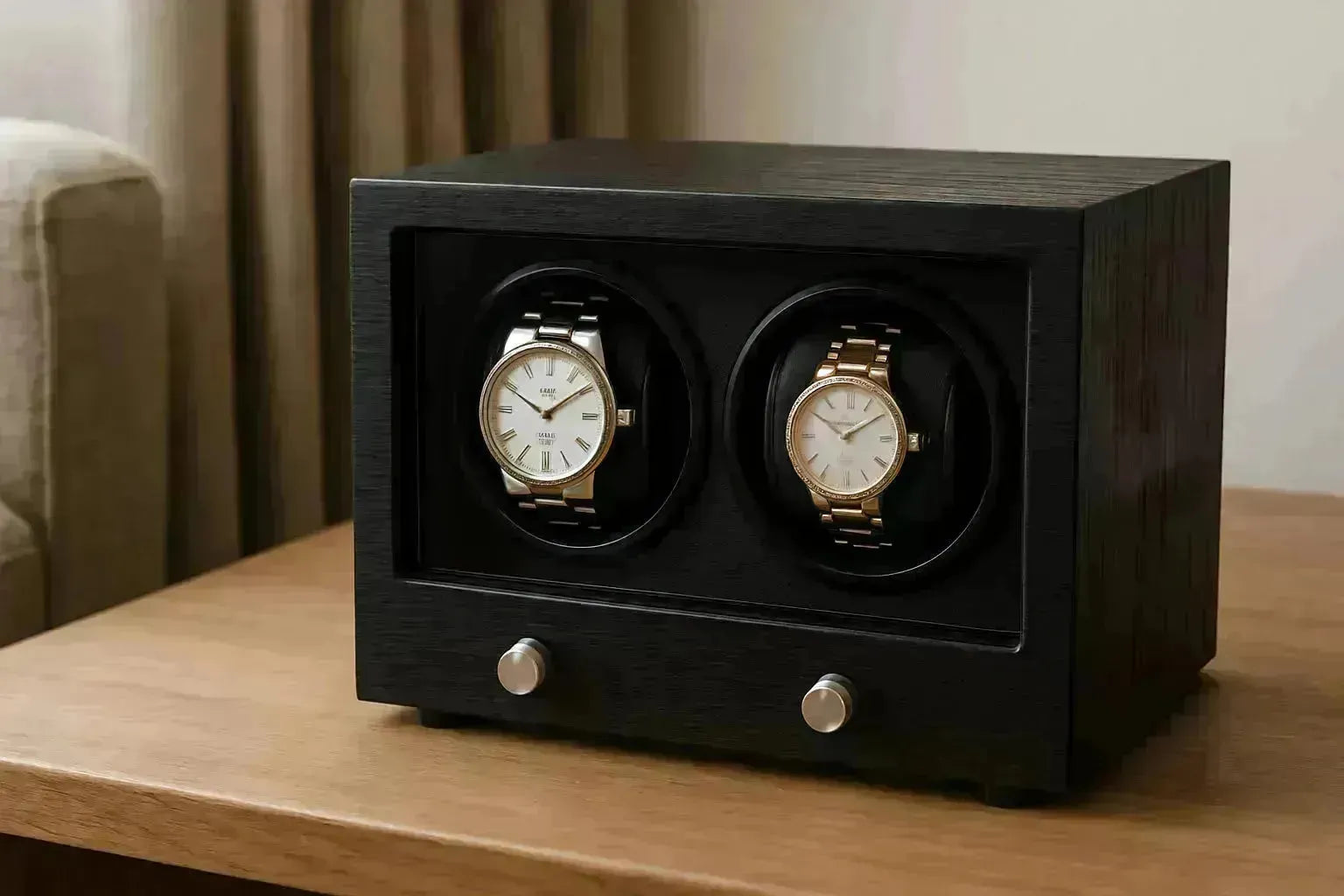 Elegant black wooden dual watch winder with two luxury watches, one silver and one gold.