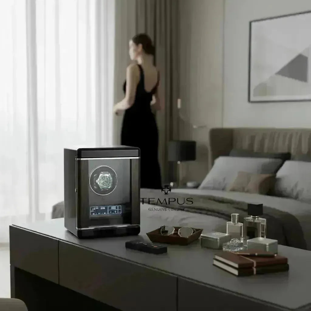 Sleek black watch winder with a luxury timepiece displayed, on a modern bedroom table.