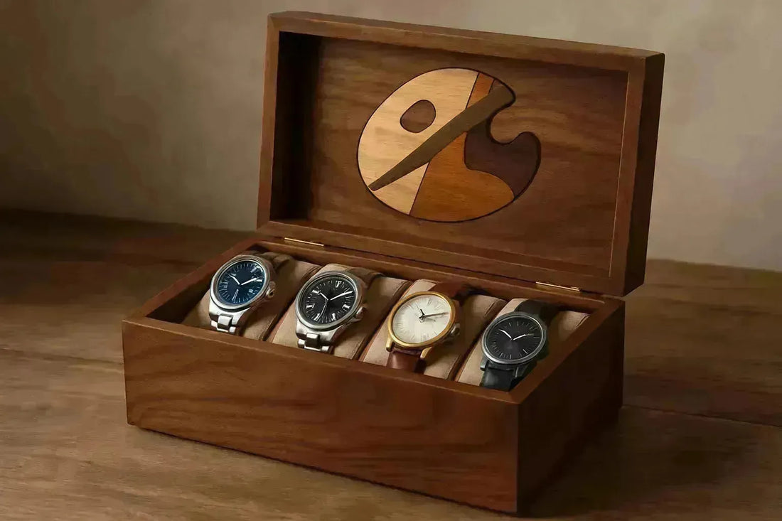 Handcrafted wooden watch box with four luxury watches and an inlaid artist's palette design.