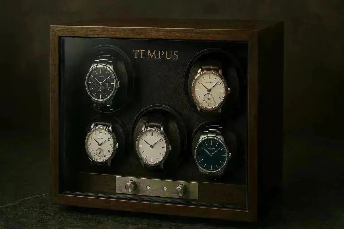 Elegant wooden Tempus watch winder displaying five luxury timepieces behind a glass front with metallic control knobs.