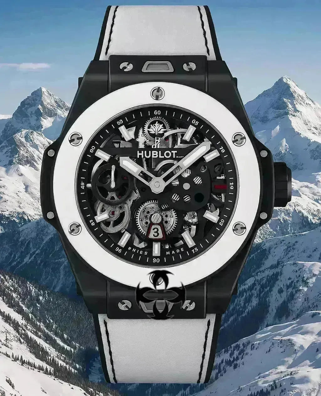 Hublot MECA-10 Aspen One luxury watch with black ceramic case, white bezel, and skeleton dial against snowy mountains.