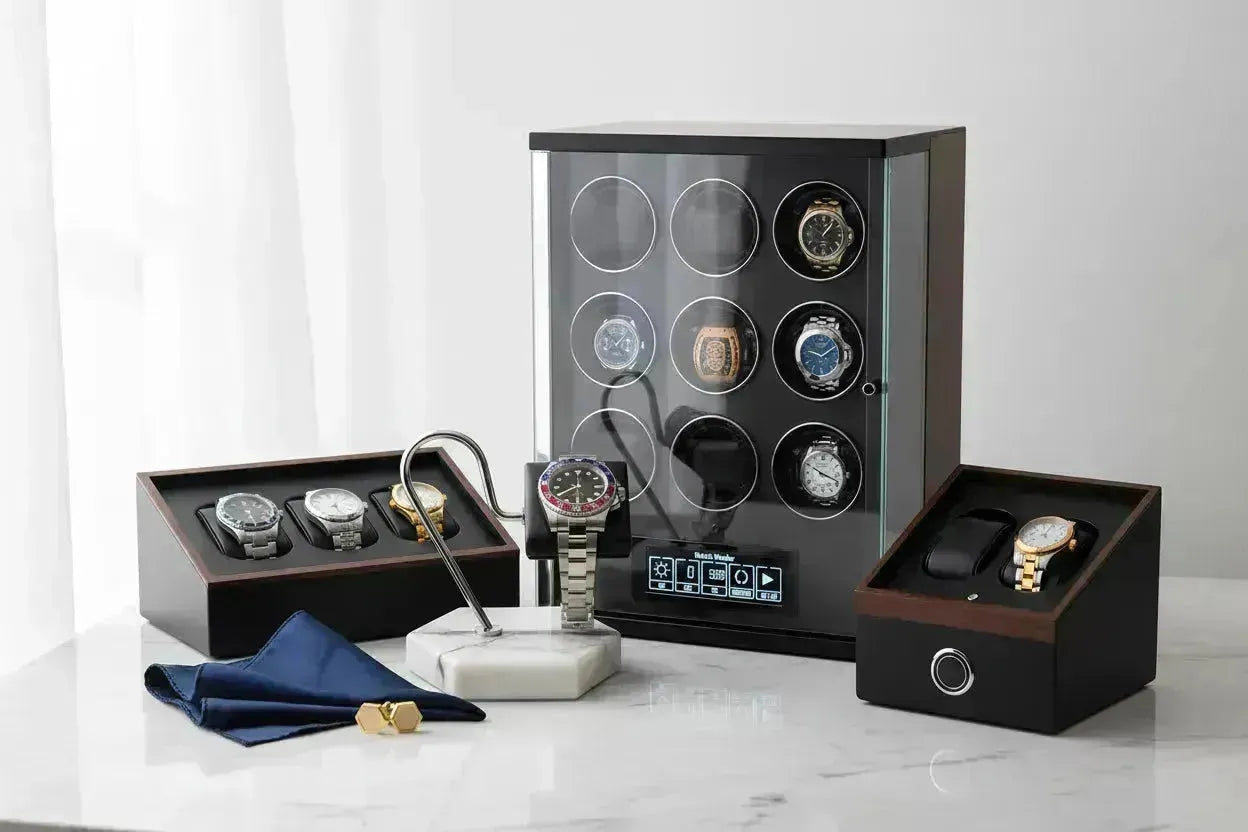Luxury watch collection displayed with a marble stand, watch winders, and storage boxes.