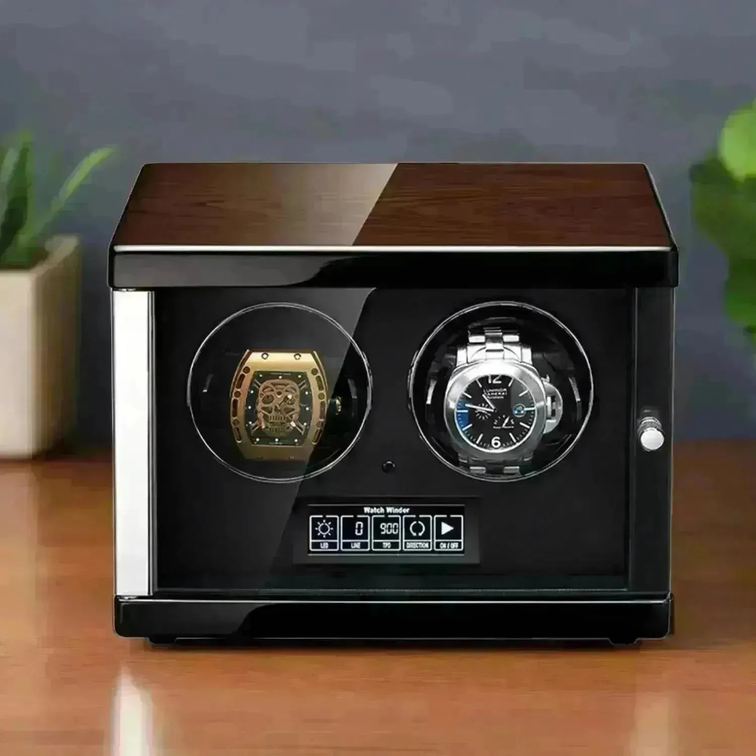 Dual-watch winder with a polished wood finish, glass display door, and digital control panel on a wooden surface.