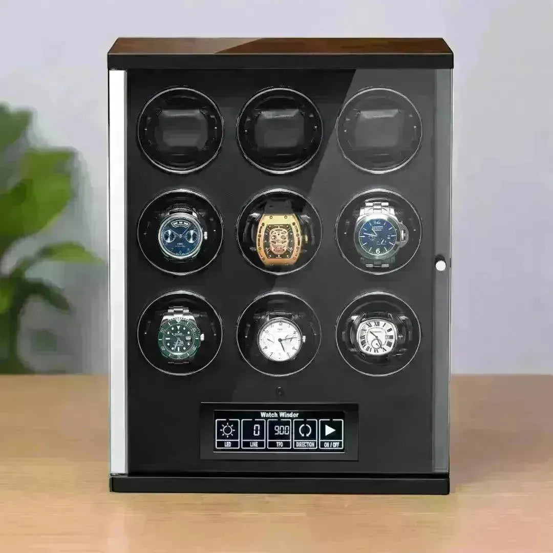 Modern black watch winder case with a glass door, digital control panel, and six luxury automatic watches on display.