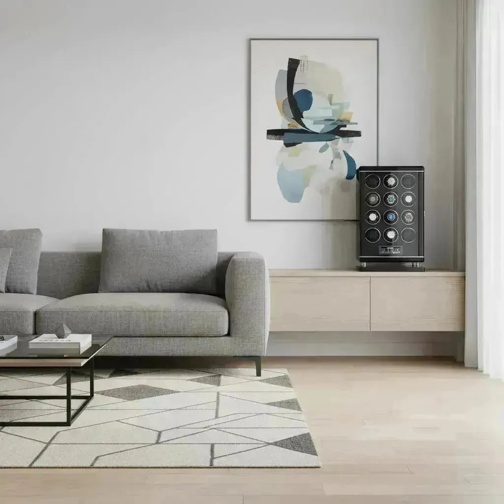 Modern living room with a sleek black touch screen watch winder displaying multiple automatic watches.