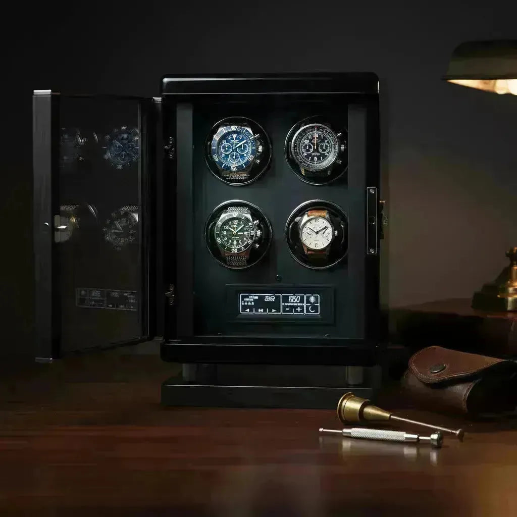 Sleek black watch winder cabinet with four luxury watches, open to reveal interior controls.