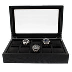The Tempus Luxury Watch Winders 10 Watch Box Premium Black Oak Veneer features a glass lid, displays three silver watches in a row, and includes padded slots for up to ten timepieces.