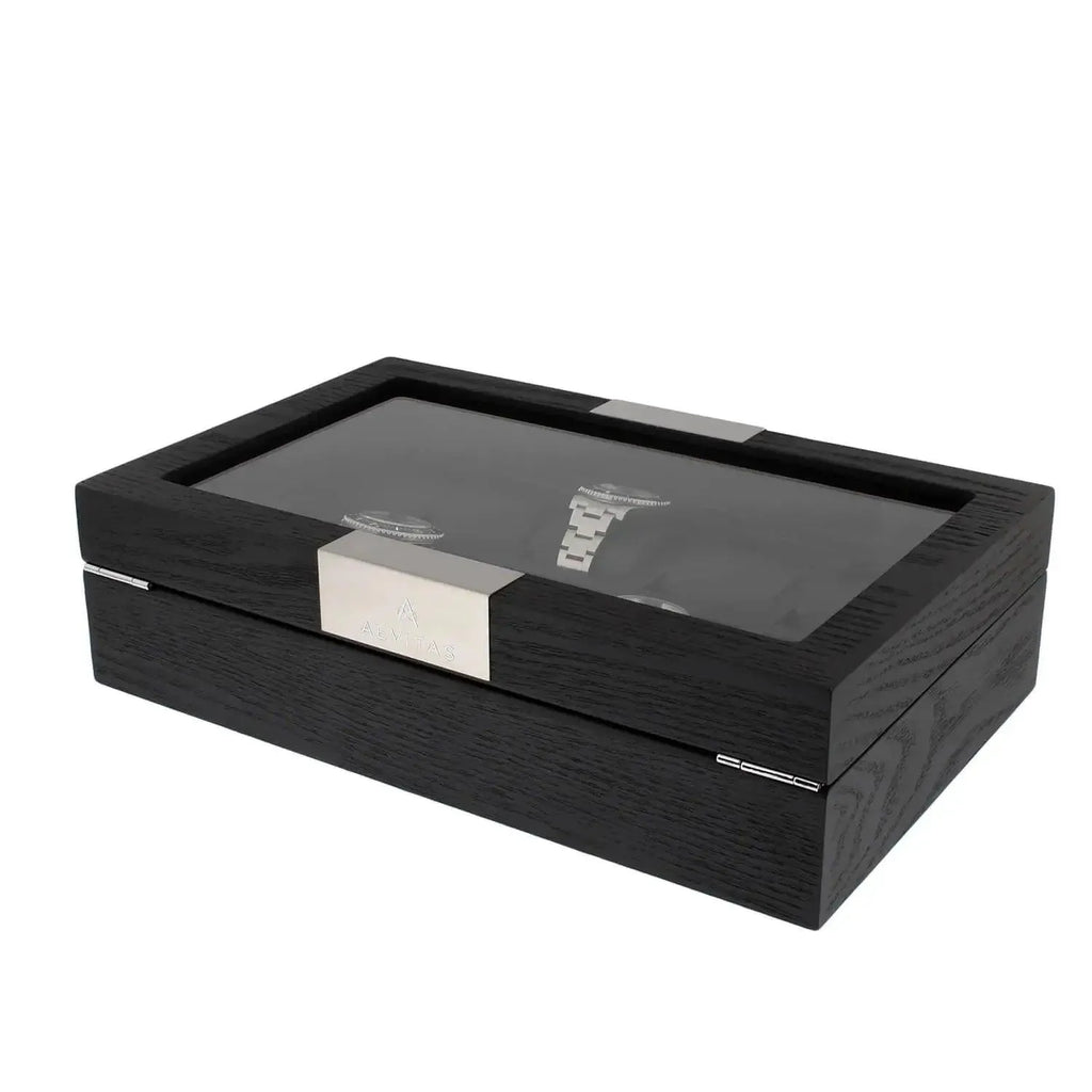 The 10 Watch Box Premium Black Oak Veneer by Tempus Luxury Watch Winders features a glass top and metallic front plaque, shown on a white background.