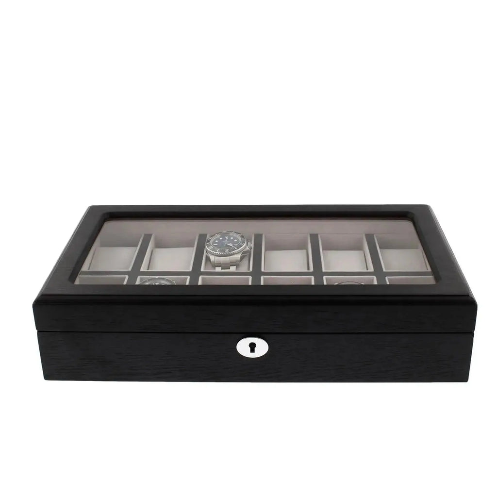 The Tempus Luxury Watch Winders 12 Watch Box, crafted in premium black oak veneer with a glass top, securely stores luxury watches in individual compartments and features a front keyhole for locking.