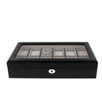 The Tempus Luxury Watch Winders 12 Watch Box, crafted in premium black oak veneer with a glass top, securely stores luxury watches in individual compartments and features a front keyhole for locking.