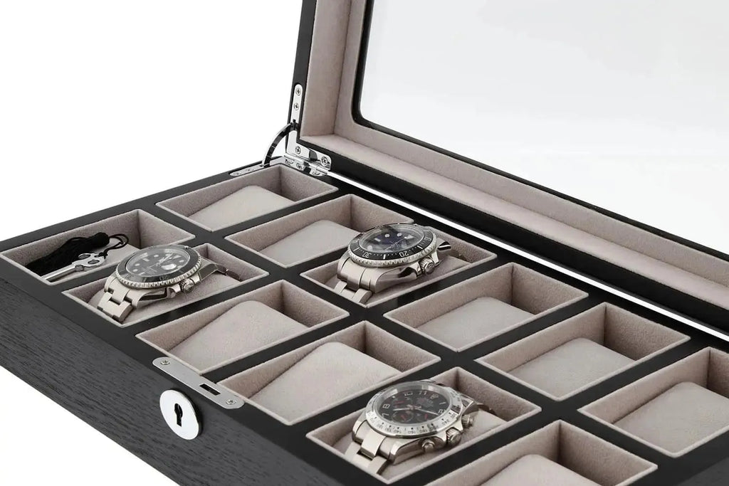 The Tempus Luxury Watch Winders 12 Watch Box features premium black oak veneer, a glass lid, and luxury storage for up to twelve wristwatches in cushioned compartments—some of which are shown empty.