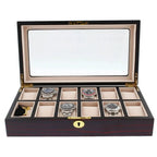 The Tempus Luxury Watch Winders 12 Watch Box in premium cherry wood satin finish features a glass lid, ten compartments—five displaying silver wristwatches, the others empty—and a small tasseled key in the front left section.