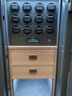 The Tempus Luxury Watch Winders 12 Watch Winder Safe Grade 1, insured up to £100,000, features twelve round dials above a digital display, premium leather accents, two wooden drawers with metal handles, and LED illumination.