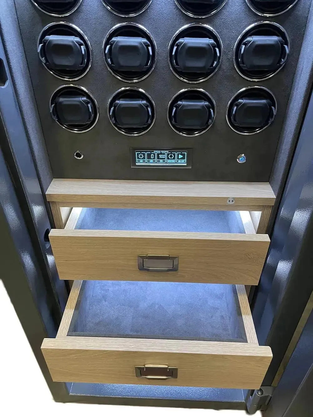 A close-up of the Tempus Luxury Watch Winders 12 Watch Winder Safe Grade 1, featuring circular compartments, a digital keypad, two open wooden drawers, and blue premium leather lining. £100,000 insurance rated with large storage.