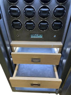 A close-up of the Tempus Luxury Watch Winders 12 Watch Winder Safe Grade 1, featuring circular compartments, a digital keypad, two open wooden drawers, and blue premium leather lining. £100,000 insurance rated with large storage.