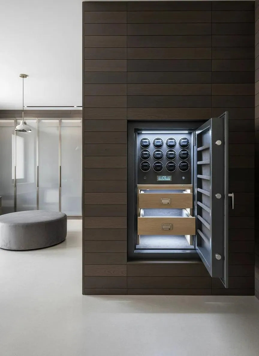 The Tempus Luxury Watch Winders 12 Watch Winder Safe Grade 2 (£175,000 insurance rated) features leather-lined drawers and multiple winders in a sleek dark wood finish, shown open beside a modern, neutral-toned room.