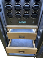 Open wooden drawers beneath a panel of circular black holders and electronic controls, part of the Tempus Luxury Watch Winders 12 Watch Winder Safe Grade 2, with a £175,000 insurance rating for securing automatic timepieces.