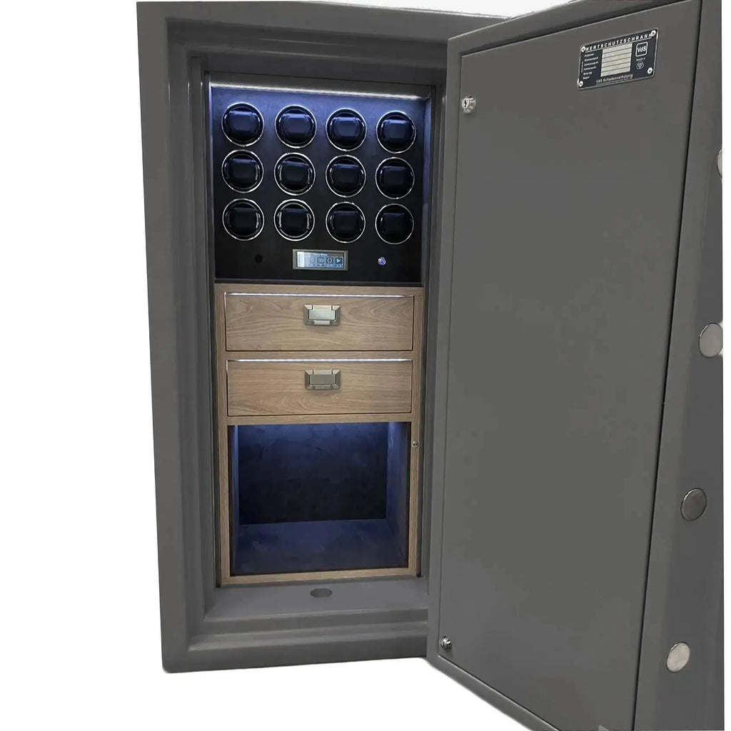The Tempus 12 Watch Winder Safe Grade 5 by Tempus Luxury Watch Winders features a gray finish, an open door revealing 12 illuminated winder slots, two wooden drawers, and a spacious storage compartment. £1,000,000 insurance rated.