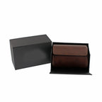 Vintage brown leather double watch roll with grey suede lining in an open black gift box.