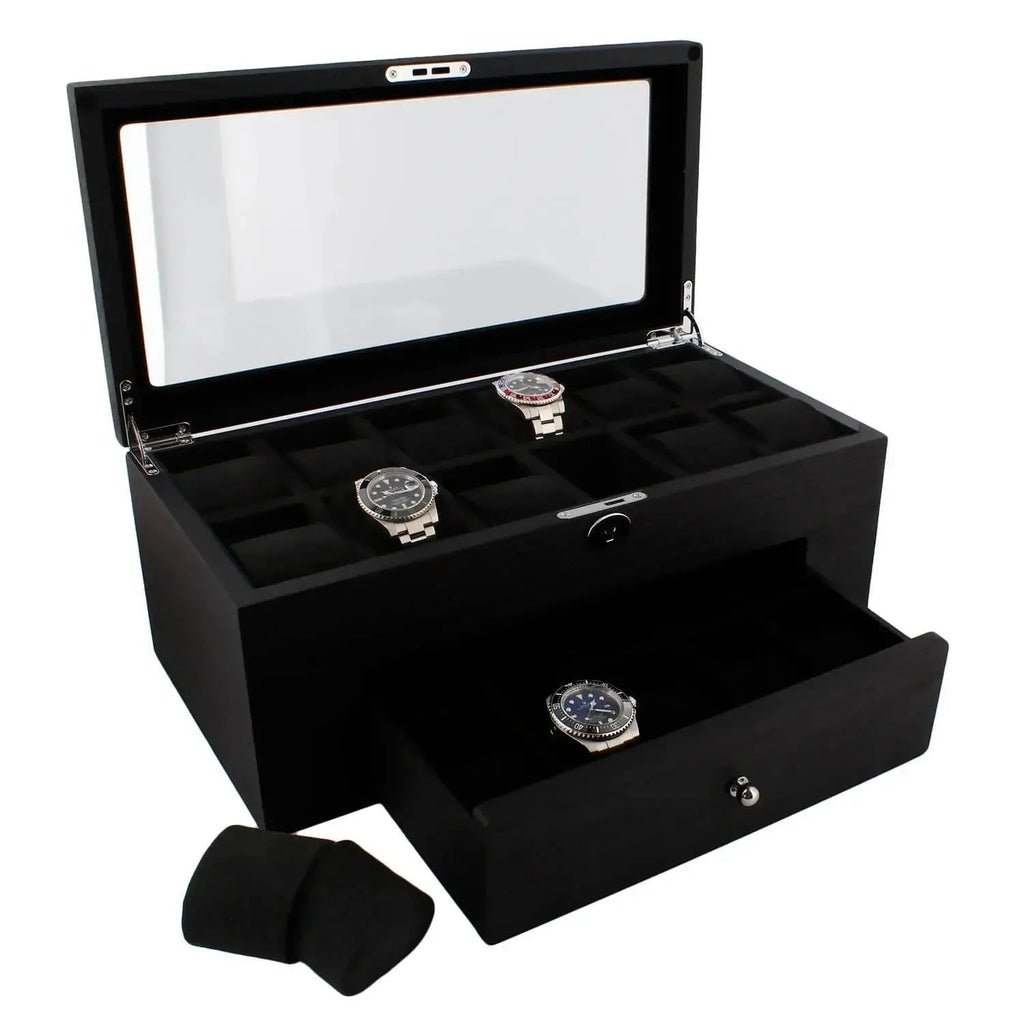 The 22 Watch Box Premium Quality Black Oak Veneer with Drawer by Tempus Luxury displays three watches under a glass lid, has multiple compartments, an open drawer holding one watch, and two watch cushions beside it.