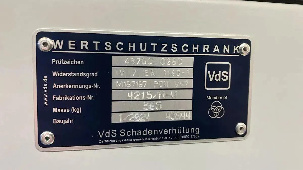 Close-up of a metal label on the Tempus Luxury Watch Winders 22 Watch Winder Safe Grade 4 (£600,000 insurance rating), showing German certification, resistance grade, serial numbers, weight, year made, VdS logo, and specs.