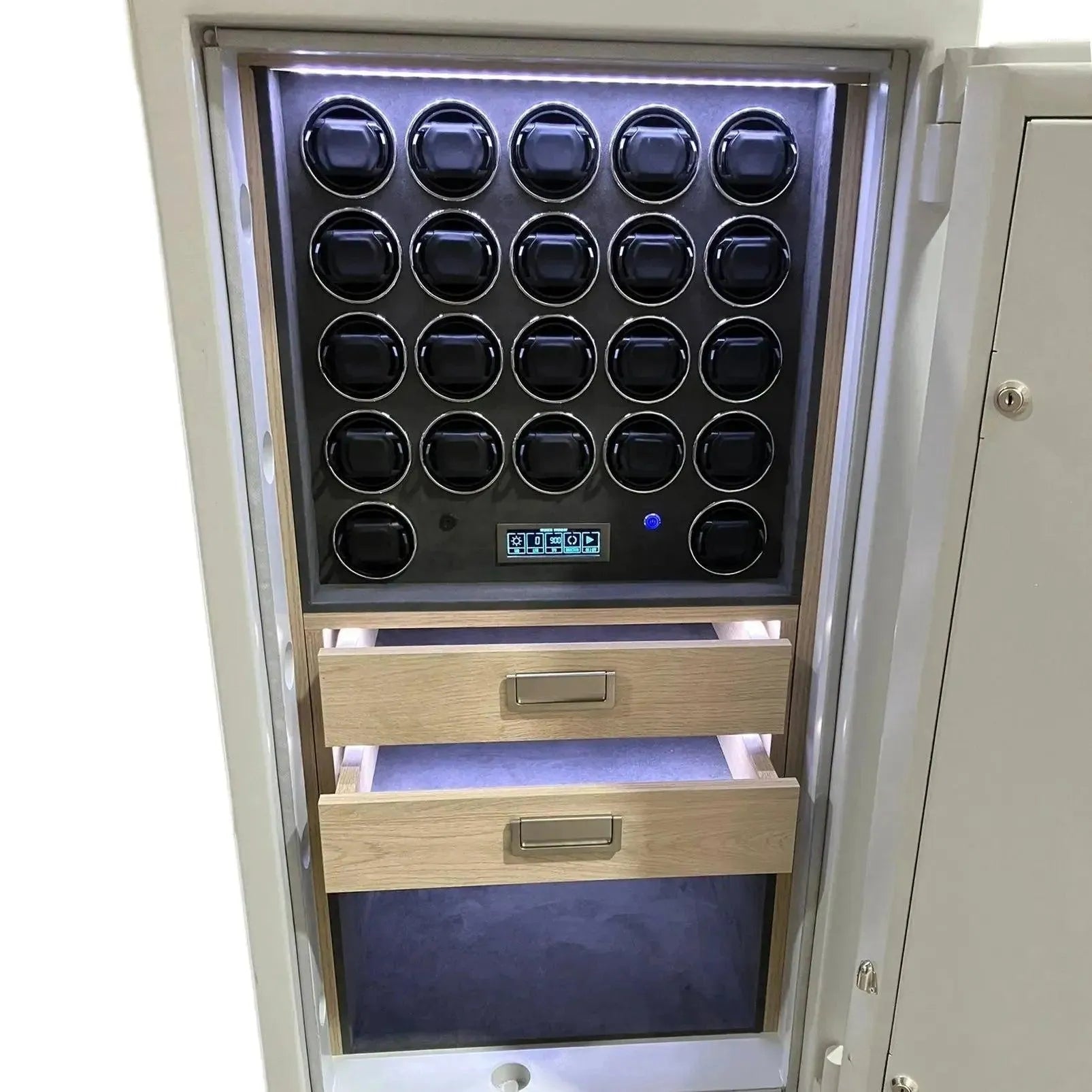 The Tempus Luxury Watch Winders 22 Watch Winder Safe Grade 4 features secure storage, an illuminated interior, 22 automatic winders arranged in four rows, and two wooden drawers with metal handles below them. £600,000 insurance rated.