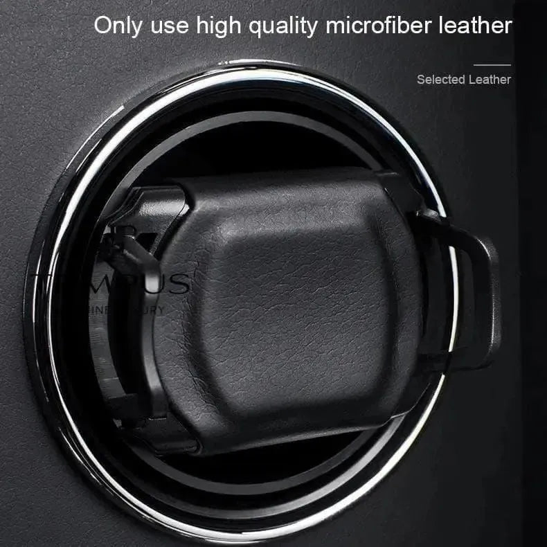 Close-up of a black car air vent with a square holder clipped on—ideal for those who value quality in their automatic watches. 