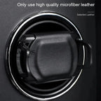 Close-up of a black car air vent with a square holder clipped on—ideal for those who value quality in their automatic watches. 