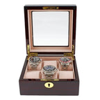 The Tempus 6 Watch Box in premium cherry wood piano gloss finish features a glass lid and luxury lining, displaying up to six wristwatches in individual cushioned slots for elegant storage.