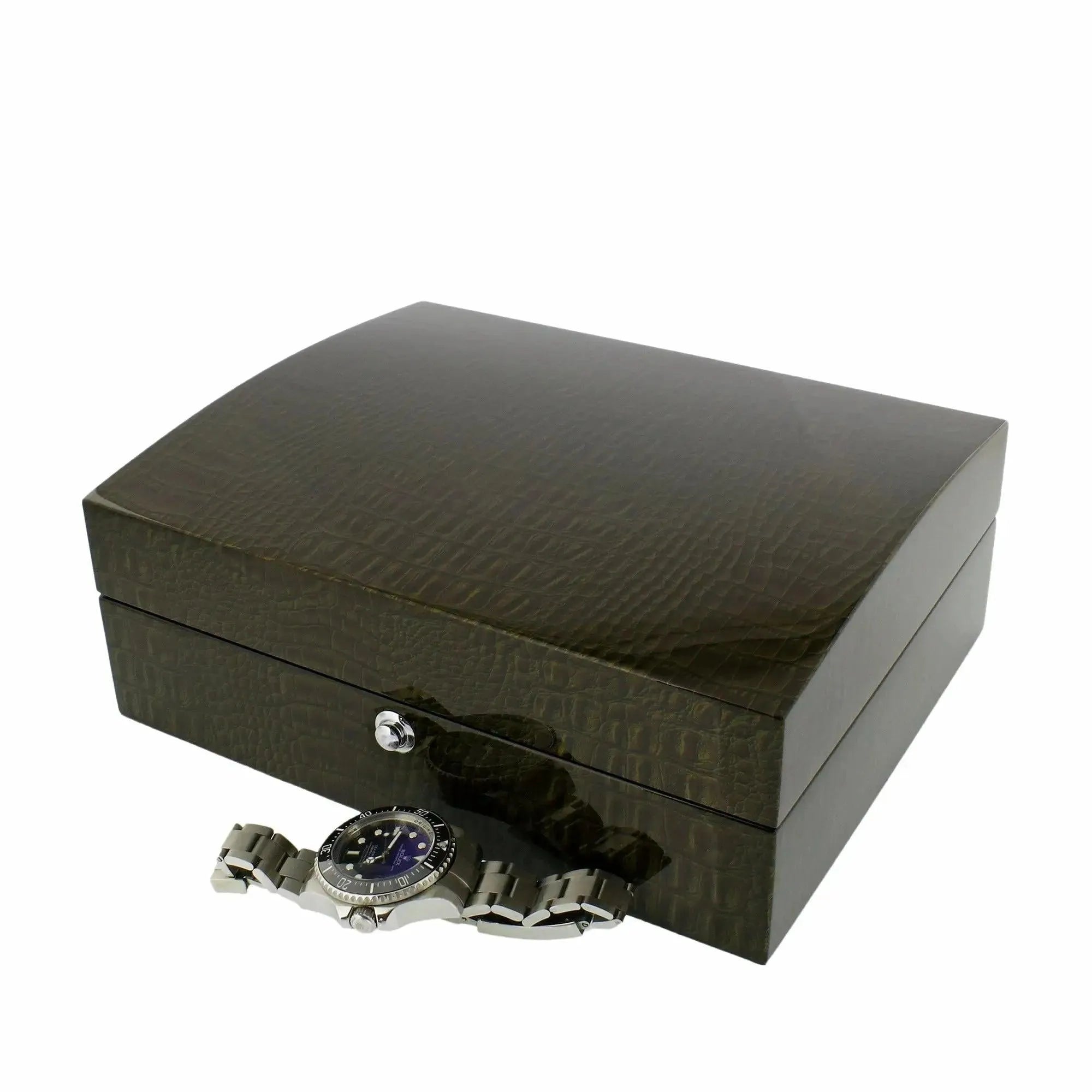 A Tempus Luxury Watch Winders 8 Watch Box in premium green high-gloss lacquered crocodile print finish sits closed, with a silver wristwatch featuring a dark face placed in front of it on a white background.