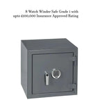 A gray Grade 1 Watch Winder Safe by Tempus Luxury Watch Winders with digital keypad and handle is shown. Text above: Grade 1 Watch Winder Safes with £100,000 Insurance Rating by Tempus for automatic timepieces.