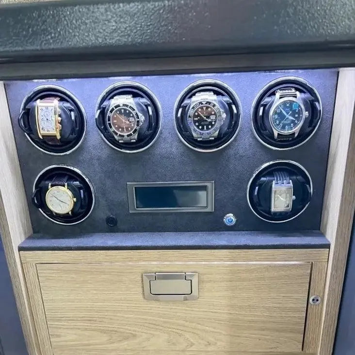 Tempus Grade 1 watch winder safe with six luxury watches, LED lighting, and a light wood drawer.