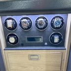 Tempus Grade 1 watch winder safe with six luxury watches, LED lighting, and a light wood drawer.