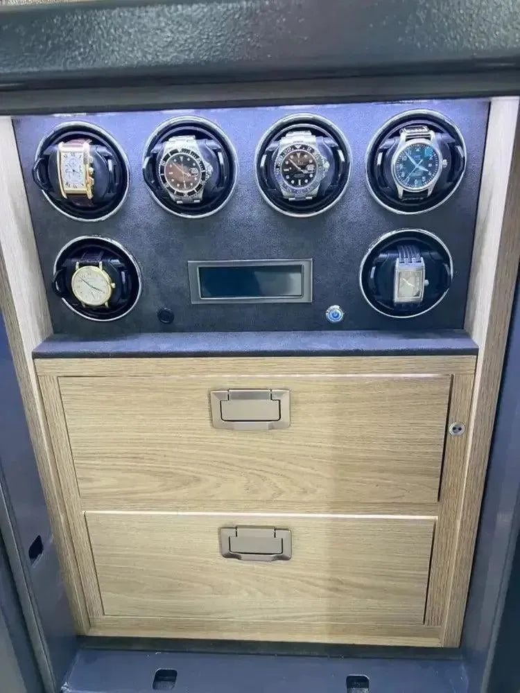 The Grade 1 Watch Winder Safe by Tempus Luxury Watch Winders has a £100,000 insurance rating and features two drawers, a display panel, and six individual rotating holders for automatic timepieces.