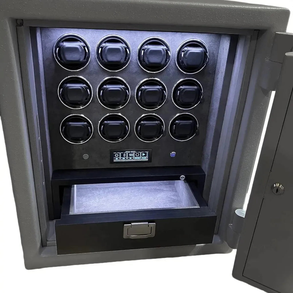 The Grade 1 Watch Winder Safe by Tempus Luxury Watch Winders features twelve black circular compartments in a 3x4 grid, a digital keypad, LED-lit premium leather interior, an empty lower drawer, and offers a £100,000 insurance rating.