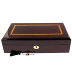 The Premium 12 Watch Box in Cherry Wood Piano Gloss Finish by Tempus Luxury Watch Winders features a decorative inlaid lid, gold keyhole, and two keys with black tassels—perfect for luxury watch storage.