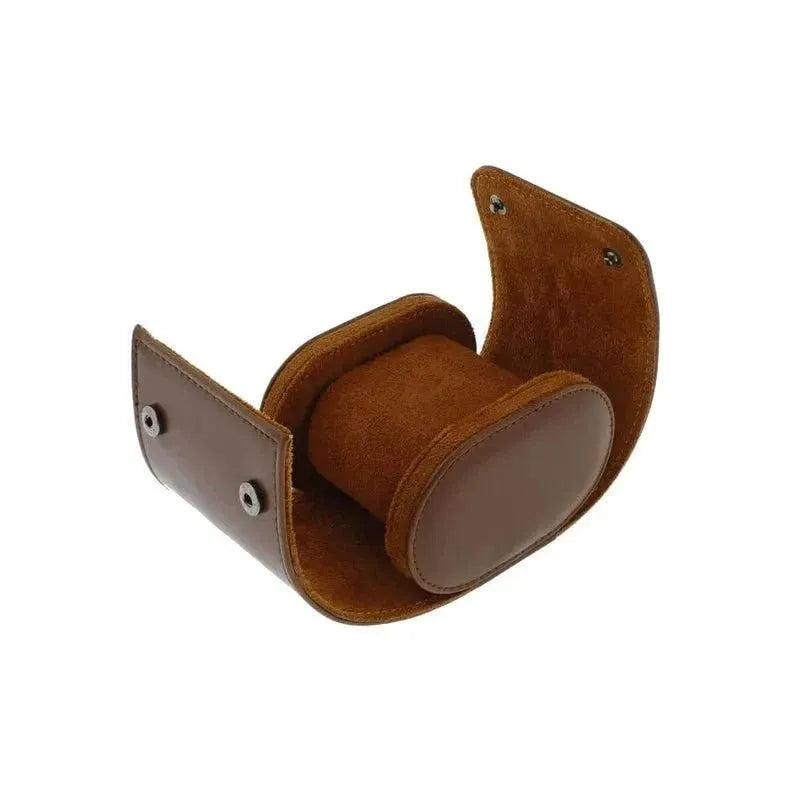 The Aevitas Premium Single Watch Roll in brown leather with super soft tan suede lining and snap closures is shown partially open on a white background, revealing its cushioned compartment for one watch.