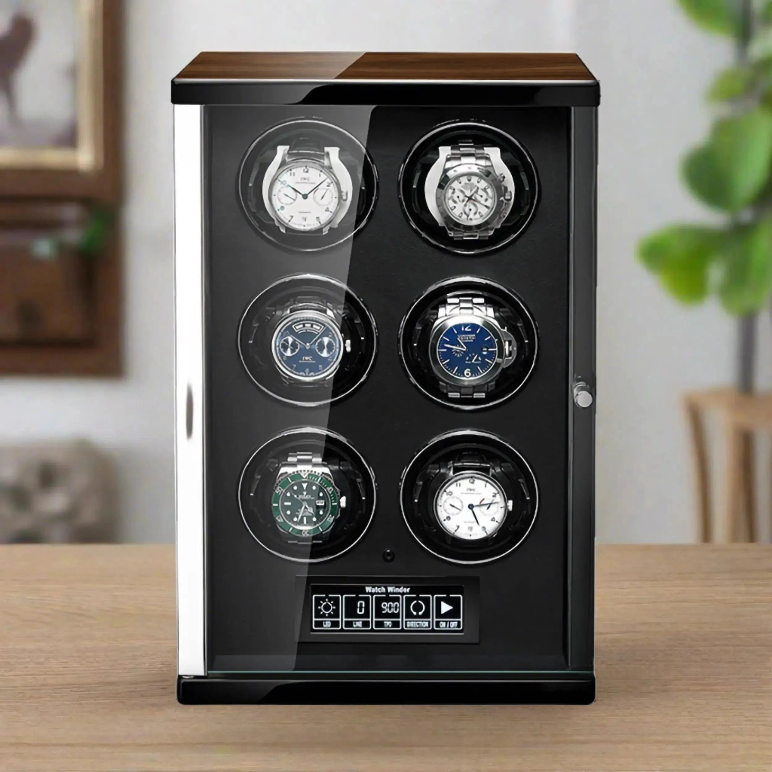 The Tempus 6 Watch Winder for Automatic Watches by Tempus Luxury Watch Winders elegantly displays six luxury wristwatches in a sleek black and glass case, featuring a digital touch screen control panel on the base.