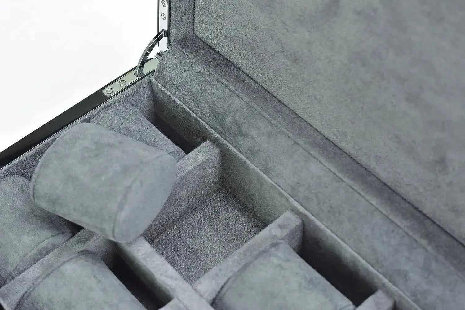 A close-up of the Tempus 8 Watch Box in Black Piano Finish by Tempus Luxury Watch Winders, featuring a gray velvet-lined interior with several cushioned watch compartments and an open display of organized storage spaces.