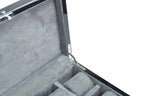 A close-up of the Tempus 8 Watch Box in Black Piano Finish by Tempus Luxury Watch Winders, showcasing its gray velvet-lined compartments and shiny metal hinge, designed for secure storage with a biometric lock.