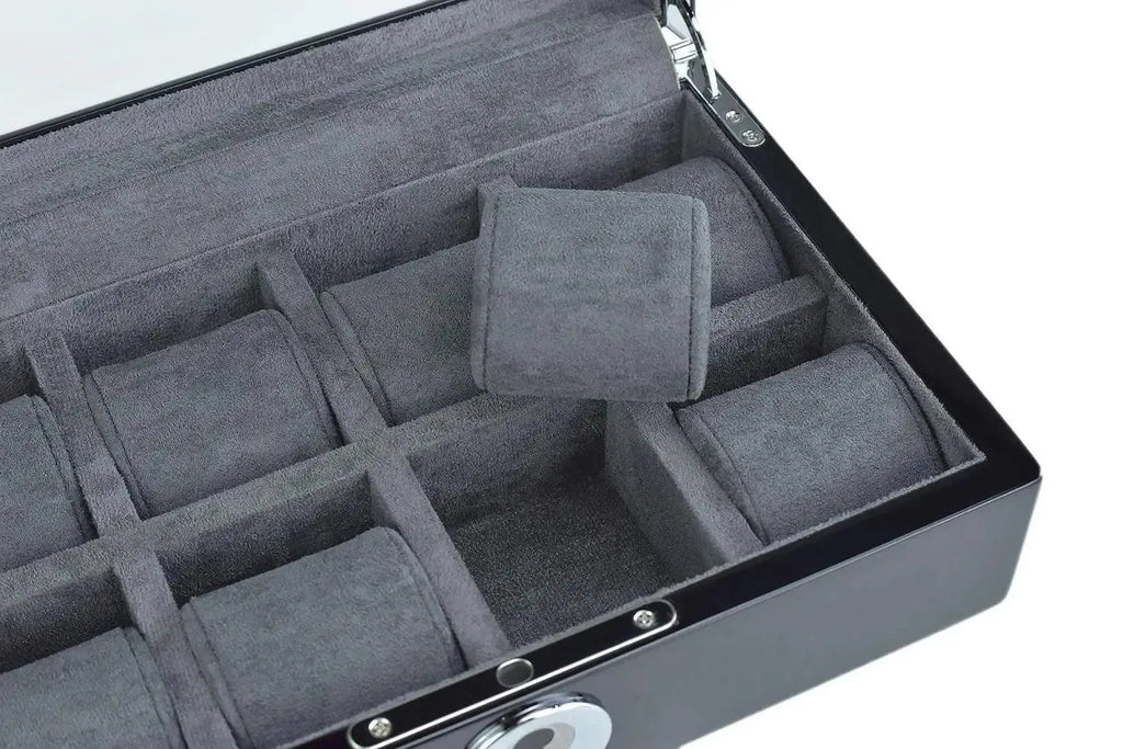 The Tempus Luxury Watch Winders Tempus 8 Watch Box in Black Piano Finish features a biometric lock, glass lid, and gray cushioned compartments—one cushion lifted to reveal organized watch storage.