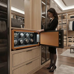 Elegant woman opening a brown leather Tempus 8 watch winder safe with eight automatic watches inside.