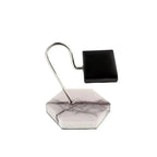 Inspired by the elegant Tempus White Marble Watch Stand with dark violet veins and black leather by Tempus Luxury Watch Winders, this modern razor stand features a hexagonal marble base, curved metal arm, and sleek black holder.
