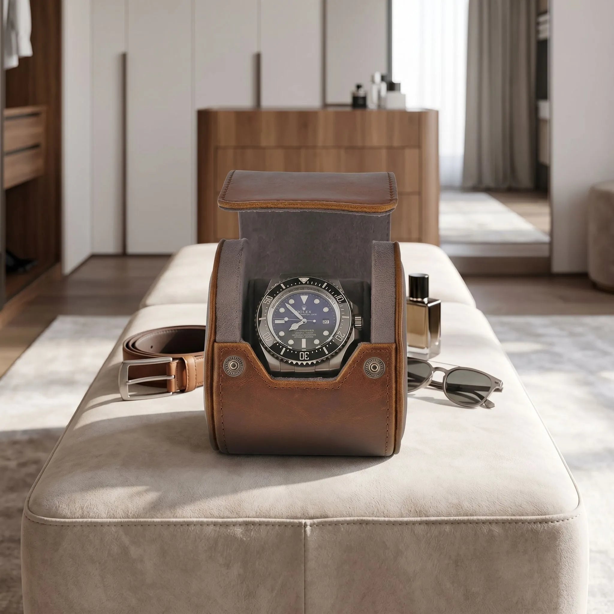 Small vintage brown leather watch roll on a dressing room bench, highlighting its craftsmanship and compact size for travel storage.