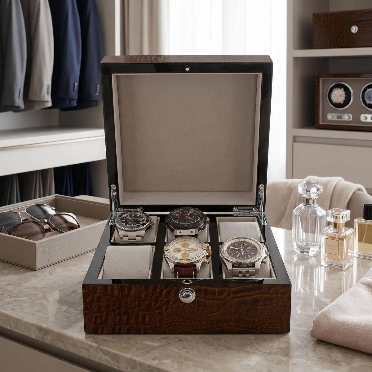Frontal shot of a luxury 6-watch box with high gloss crocodile finish, in a bright, stylish dressing room setting.