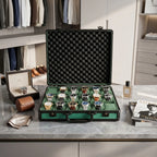 Full-body view of green 18-watch briefcase placed on a dressing table in a bright, modern dressing room environment.