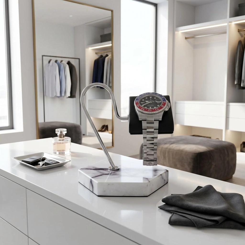 Full-body view of the luxurious marble watch stand with black leather cushion in a high-end walk-in dressing room.