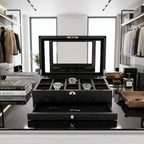 Detailed front view of the 10 Watch Box in a modern dressing room, showcasing its textured oak veneer, padded compartments, and additional storage drawer.